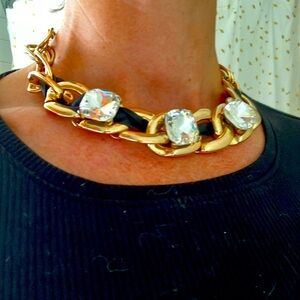Gold chain and faux diamond costume necklace.